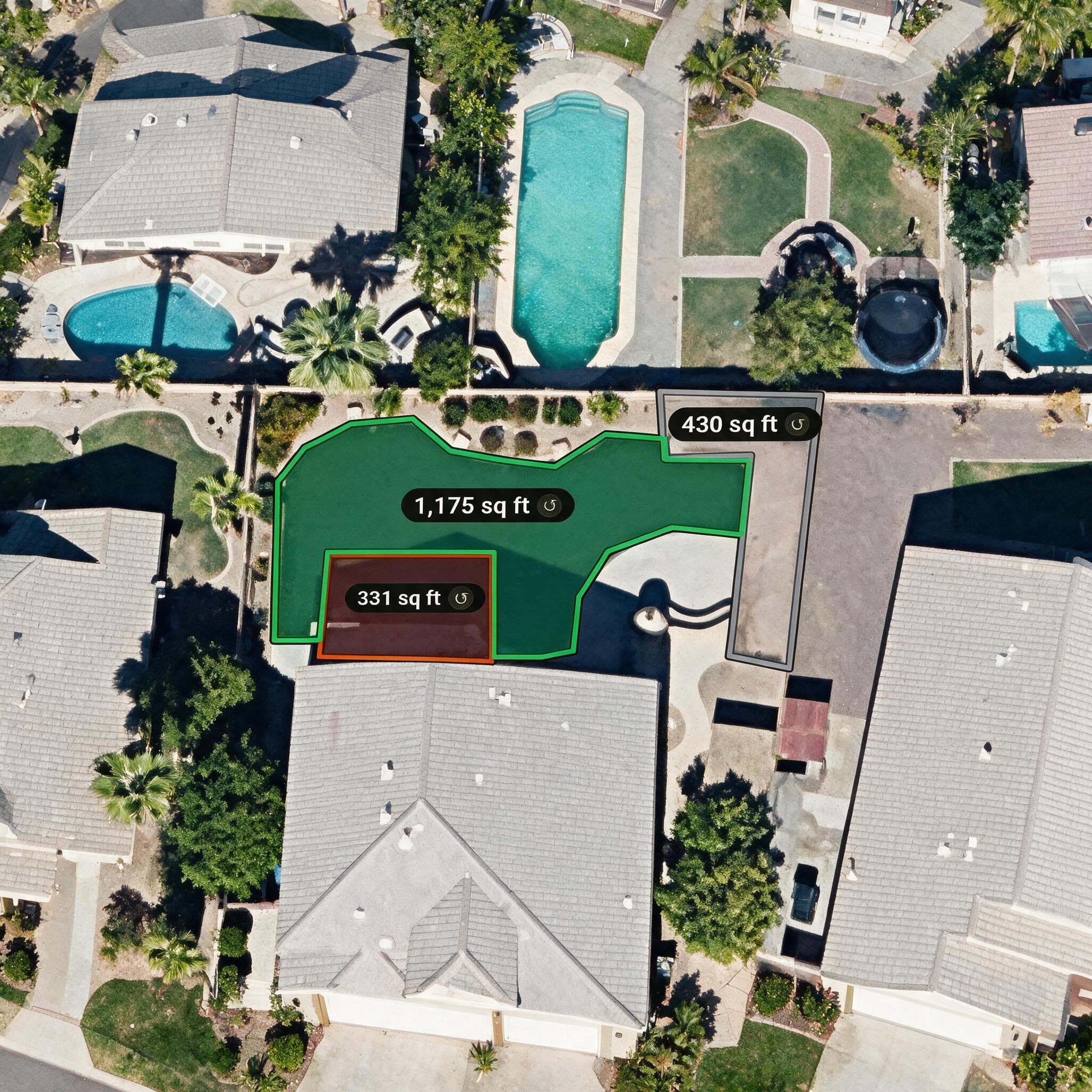 An aerial view of a property with three yard areas outlined and each one labeled with its square footage.